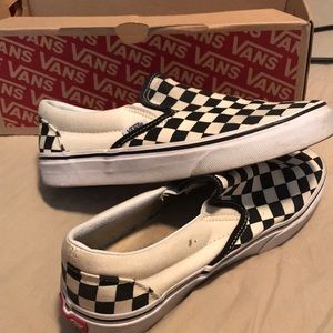 Black and white checkerboard slip-on Vans